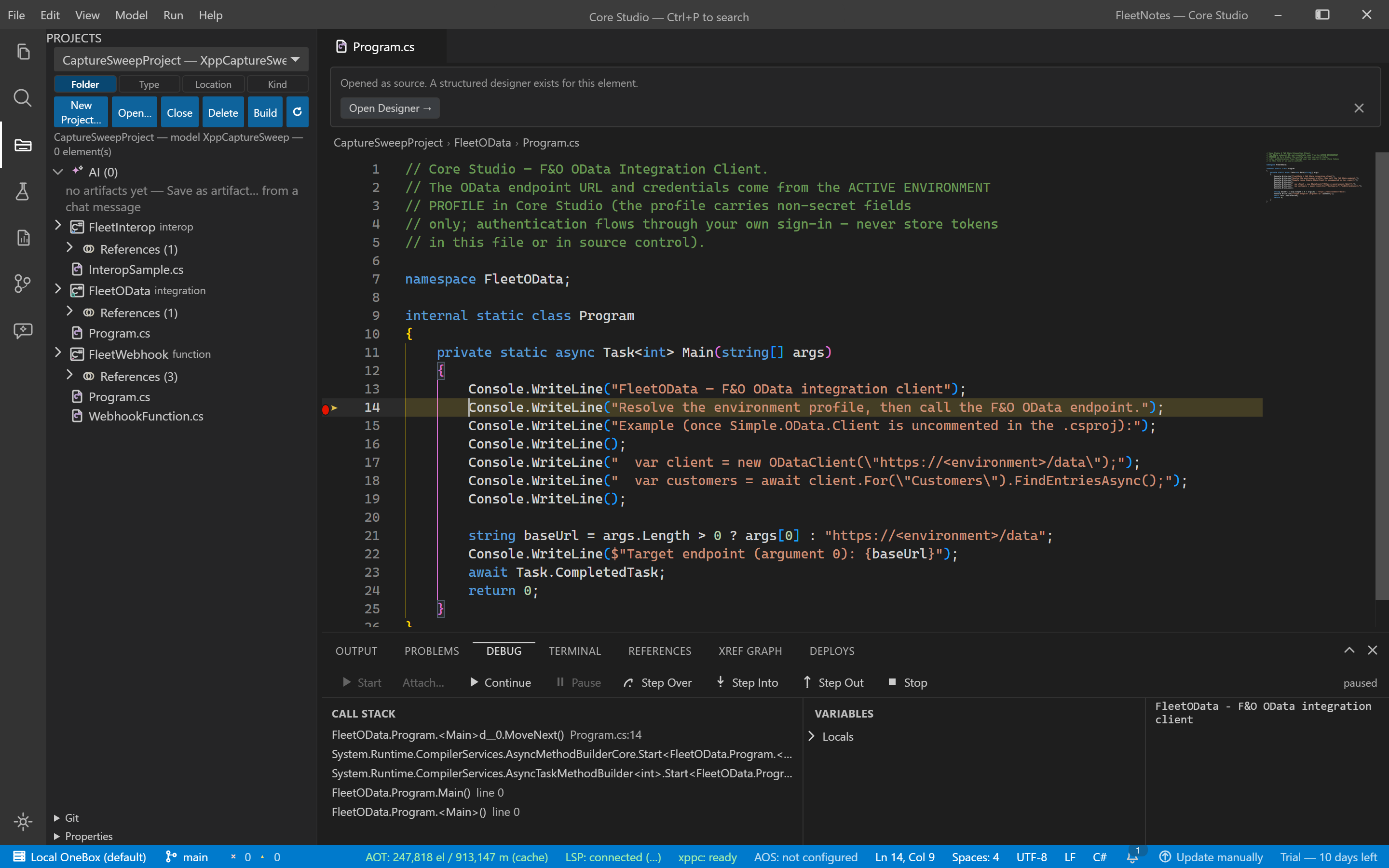 A paused C# debugging session showing locals and the call stack at a breakpoint
