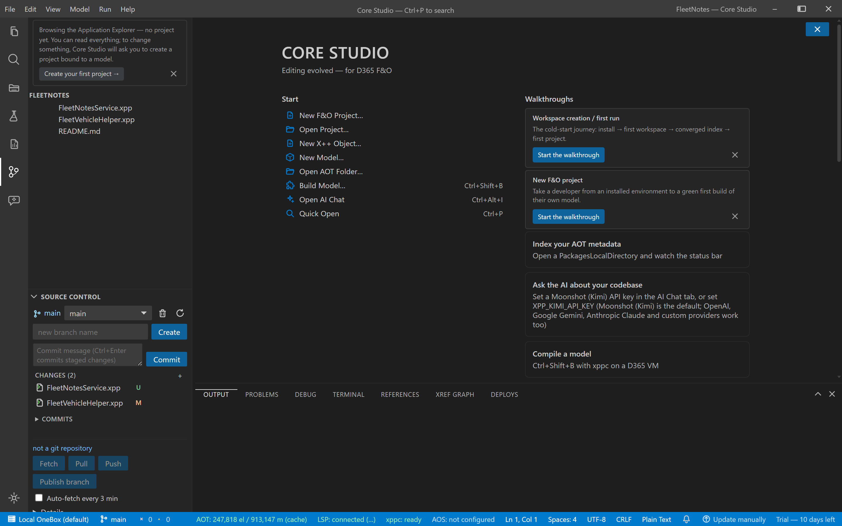 The Source Control panel listing two staged changed files with stage and commit controls